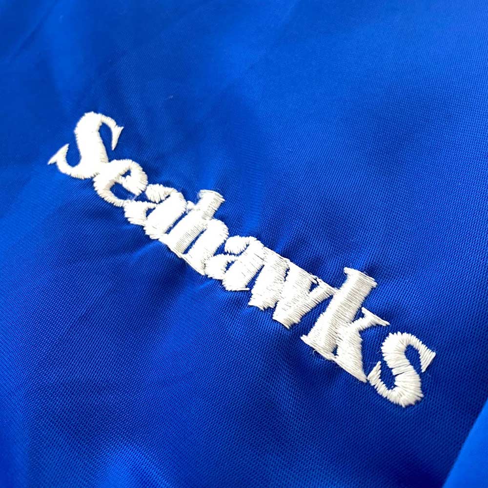 https://www.jacketsmasters.com/wp-content/uploads/2023/09/1990s-seattle-seahawks-royal-jacket.jpg